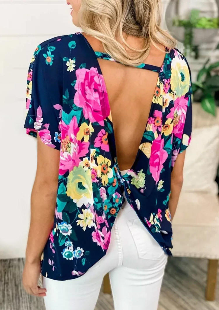 Blouses Twist Open Back Floral Blouse in Blue. Size 
Blouses Twist Open Back Floral Blouse in Blue. Size
