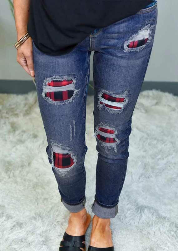 ripped jeans with patches underneath