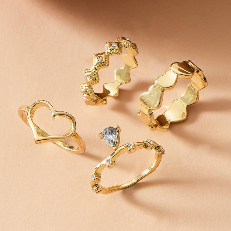 

Rings 4Pcs Valentine Hollow Out Heart Rhinestone Rings Set in Gold. Size