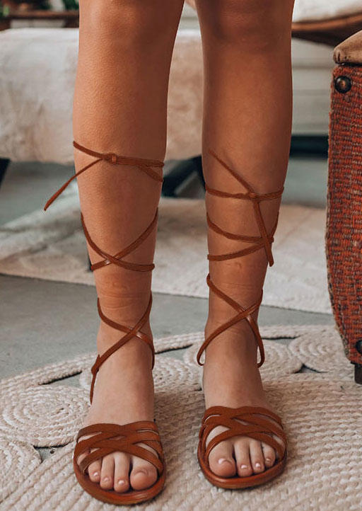 

Sandals Criss-Cross Lace Up Flat Sandals in Brown. Size: ,40
