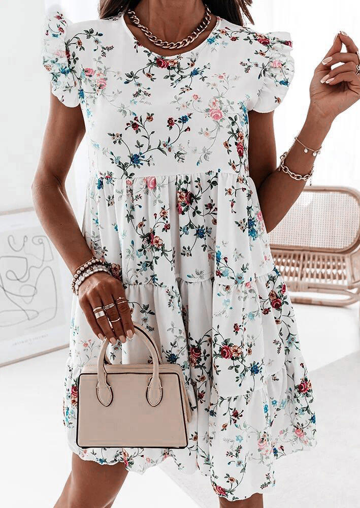 

Mini Dresses Floral Ruffled O-Neck Mini Dress in White. Size