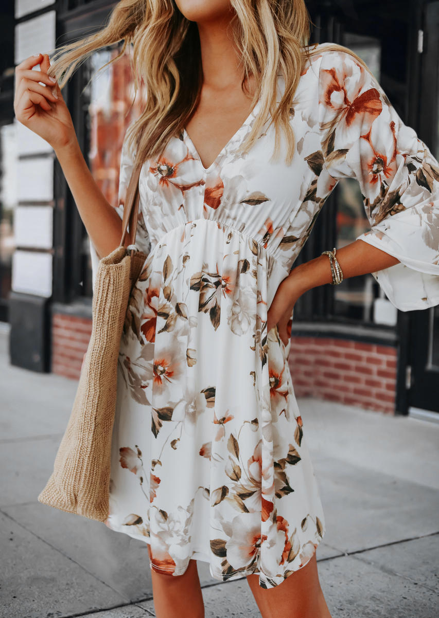 

Mini Dresses Floral Ruffled V-Neck Mini Dress in White. Size