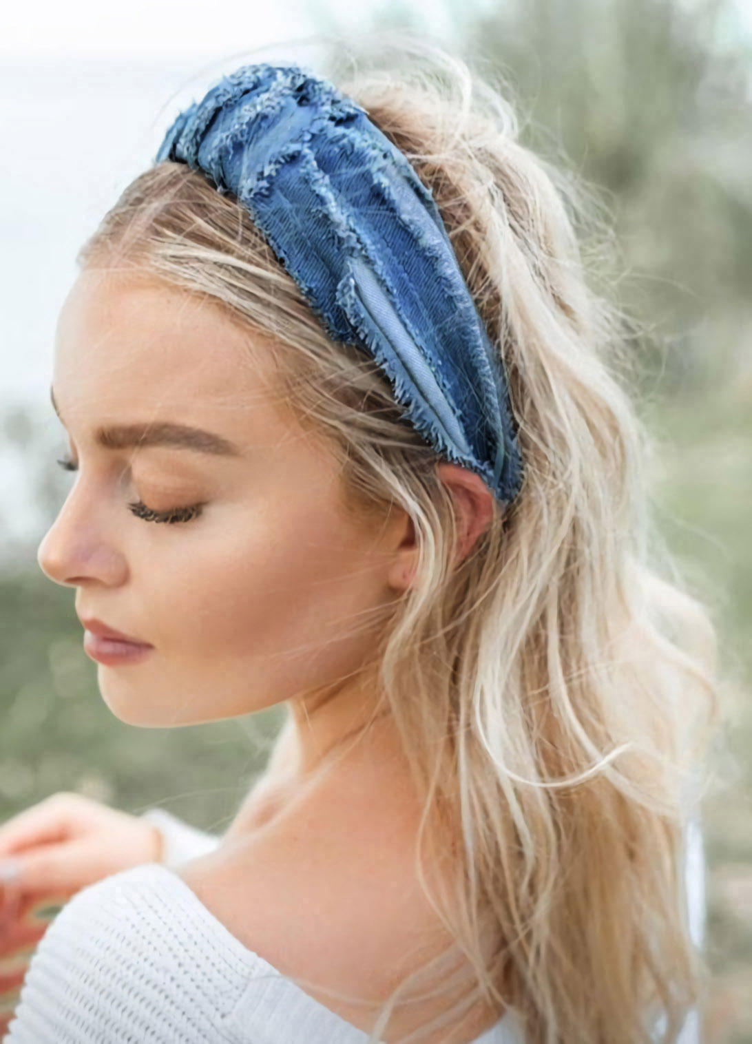 

Twist Knot Distressed Denim Headband in Light Blue. Size