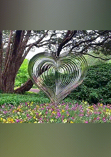 

Cool Gadgets Beating Heart Metal Spinner Wind Chime in Silver. Size