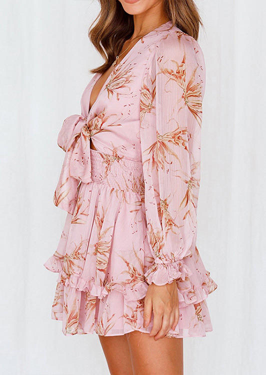 

Mini Dresses Floral Ruffled Tie Smocked Waist Mini Dress in Pink. Size: ,M,L