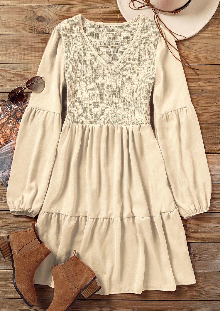 

Mini Dresses Ruffled Smocked Long Sleeve V-Neck Mini Dress in Apricot. Size