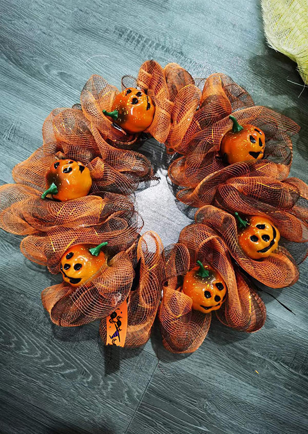 

Halloween Pumpkin Face Wreath Ornament in Orange. Size