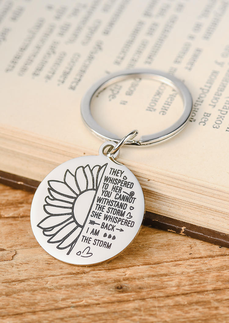 

Keychains They Whispered To Her You Cannot Withstand The Storm Sunflower Keychain in Silver. Size