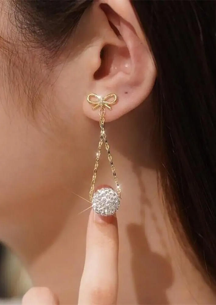 

Earrings Rhinestone Bowknot Alloy Earrings in White. Size