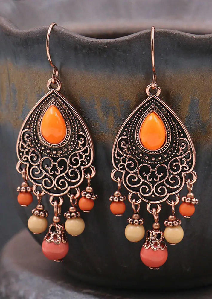 

Earrings Hollow Out Tassel Bohemian Drop Earrings in Orange. Size