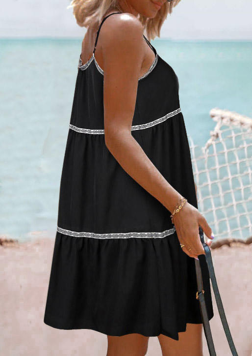 

Mini Dresses Ruffled Pocket Glitter Open Back Spaghetti Strap Mini Dress in Black. Size: L,M