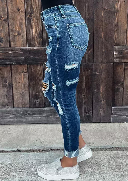 

Pants Leopard Ripped Button Pocket Skinny Jeans in Blue. Size
